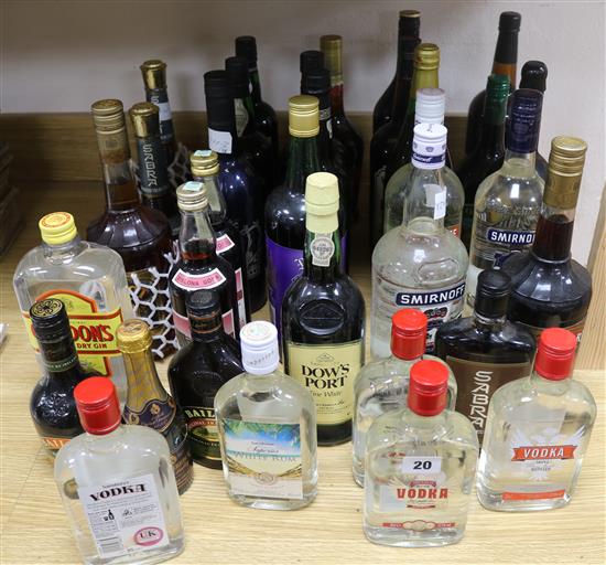 Thirty three assorted bottle of spirits, ports, sherries, liqueurs etc. including Blandys Madeira and Smirnoff vodka.